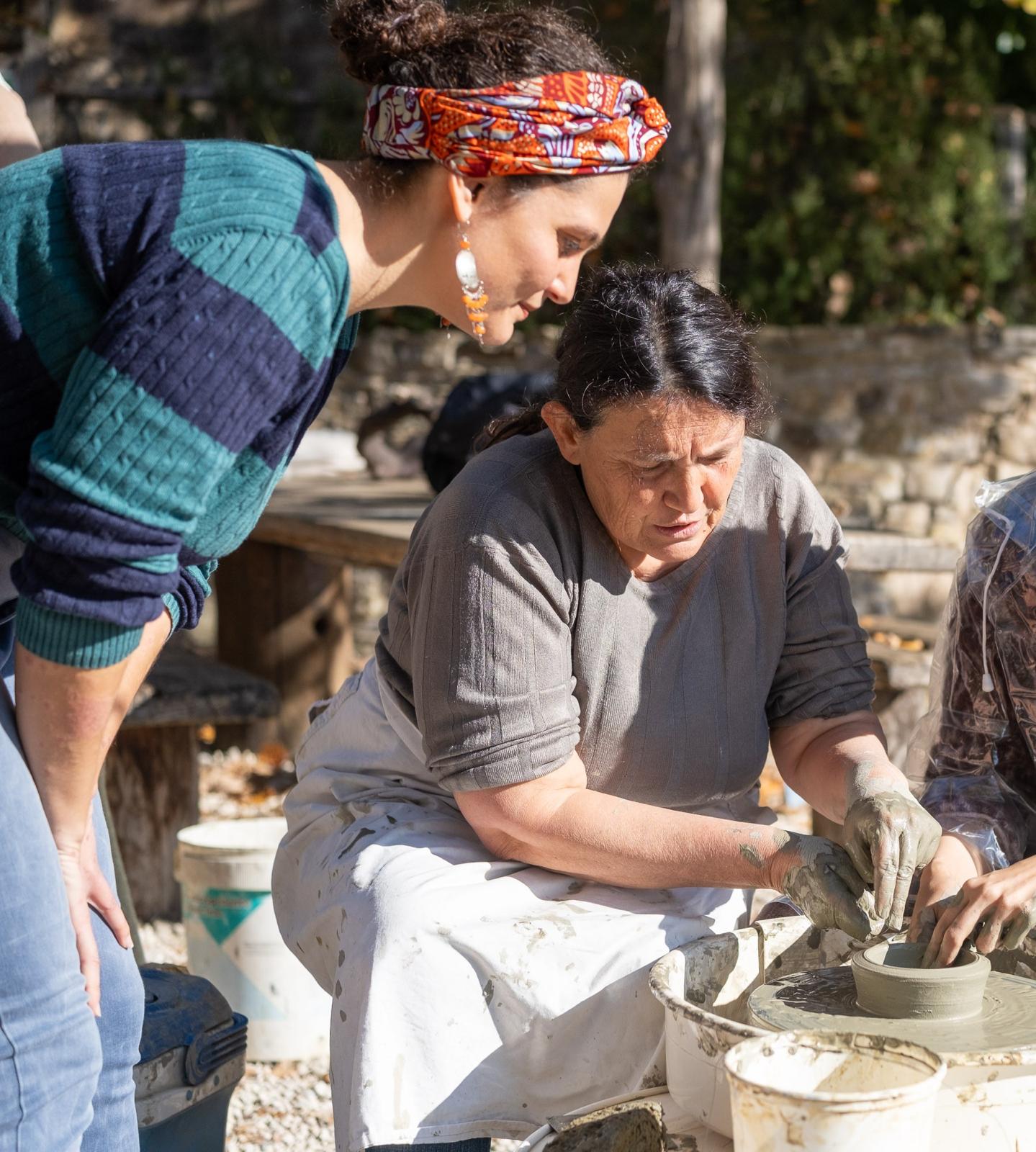 Local ceramicist guiding pottery at Eremito